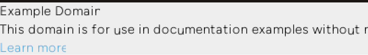 Zoomed crop showing example.com's heading rendering as 'Example Domair' and its link as 'Learn mor', both missing their final character